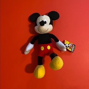 DISNEY’s MICKY MOUSE PLUSH DOLL.